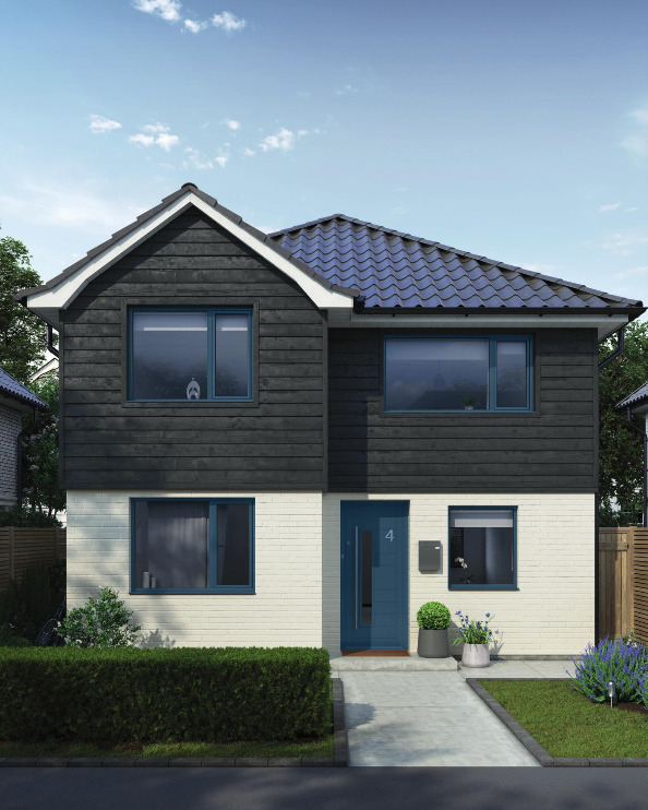 A modern house with cladding painted in a dark almost black colour giving a sleek stylish look